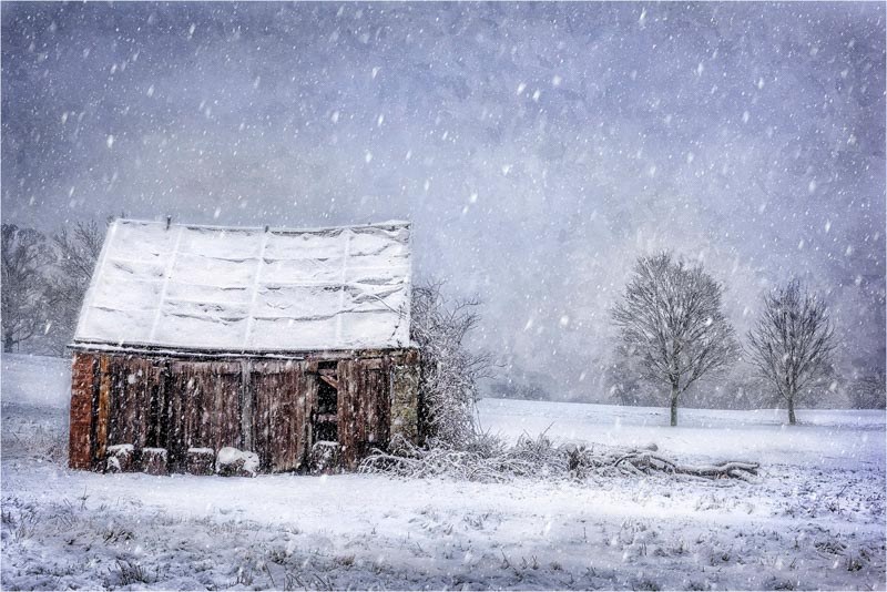 Winter shack in snowy landscape